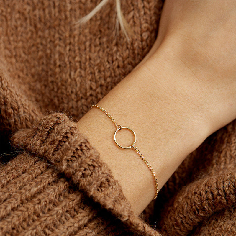 Radiant Circle: Gold-Plated Stainless Steel Round Bracelet